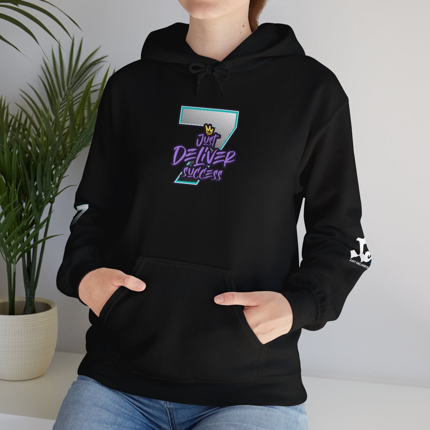 Unisex Just Deliver Success That City 7 Sweater in black, featuring colorful graphic design and kangaroo pocket.
