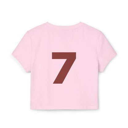 Just Deliver Success Women's Baby Tee That City 7 Collection pink cropped tee with large brown number 7 on the back.