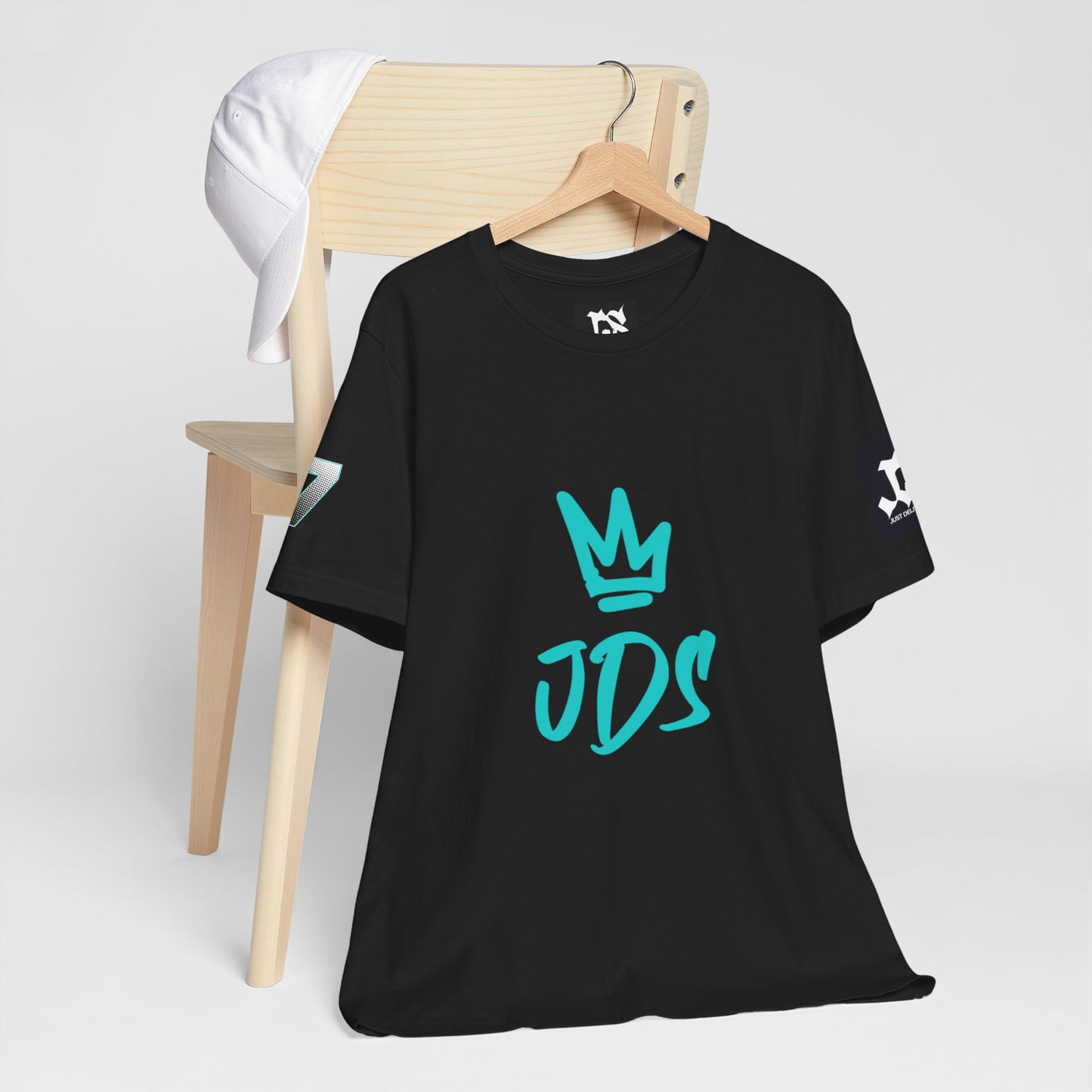 Just Deliver Success Blue Combo That City 7 Summer Collection black t-shirt displayed on a wooden chair.