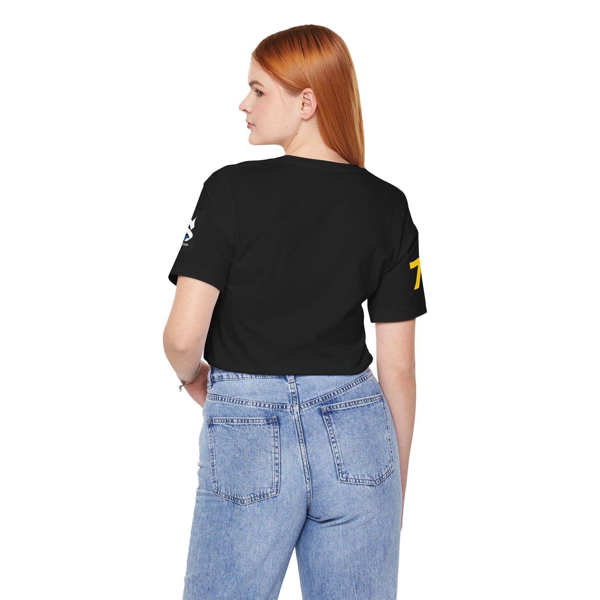 Back view of a woman wearing the Just Deliver Success Gold That City 7 Summer Collection t-shirt in black.