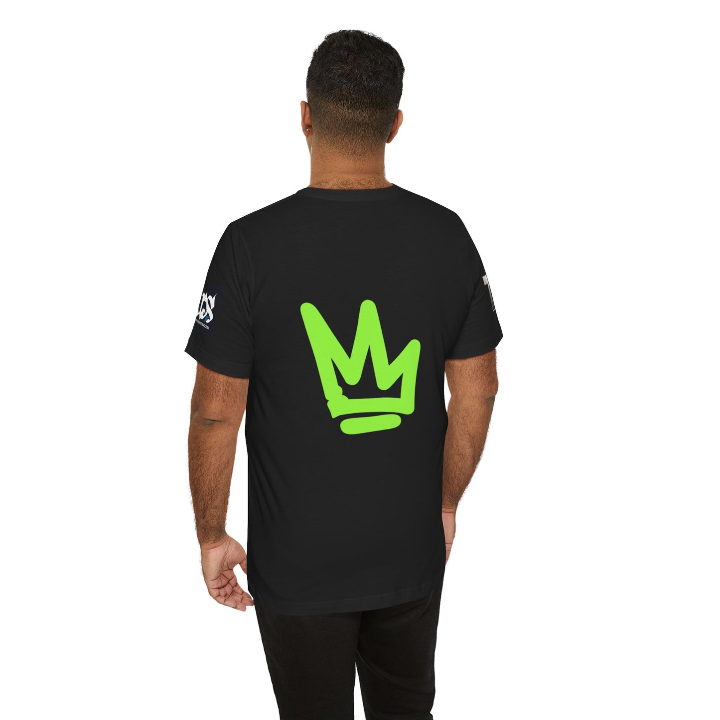 Model wearing black t-shirt featuring green crown design on the back from Just Deliver Success Da Desert That City 7 Summer Collection.