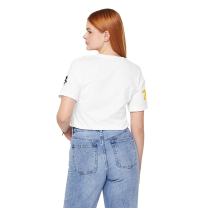Back view of model wearing Just Deliver Success Gold That City 7 Summer Collection T-shirt in white.